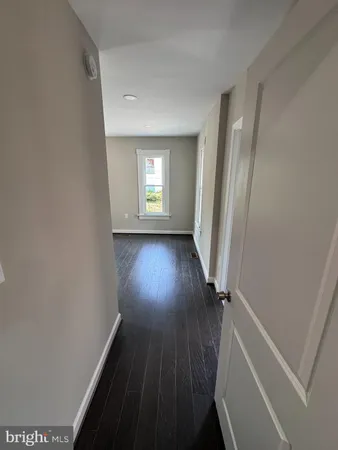 a view of entryway with wooden floor
