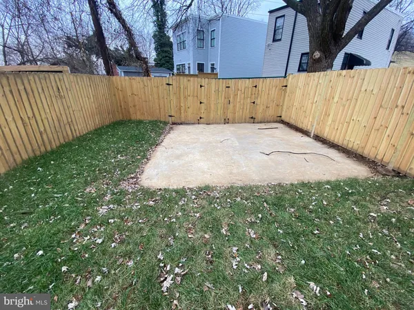 a view of a backyard of the house