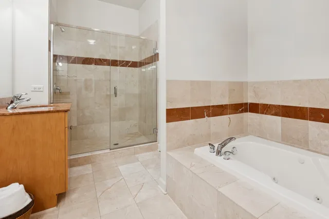 a bathroom with a bathtub and shower