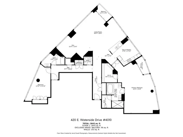 a kitchen with a chandelier stainless steel appliances and chandelier