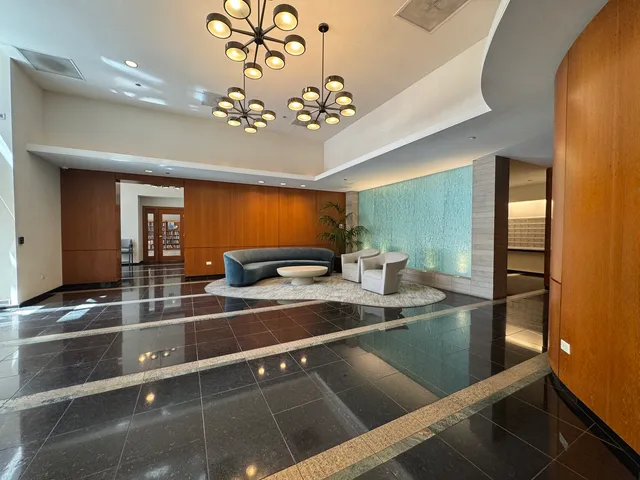 a living room with furniture a rug and a fireplace