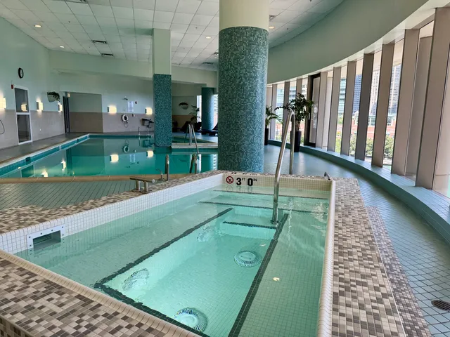 a living room with furniture fireplace and windows