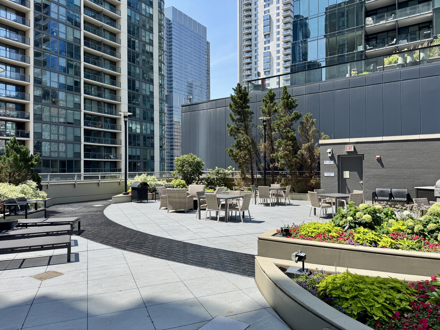 420 East Waterside Drive, Unit 4010 Chicago, IL 60601 - Photo 34 of 39 a view of a patio with couches and a potted plant