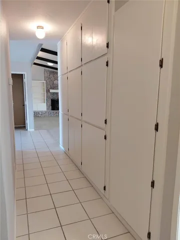 a view of a hallway with closet area