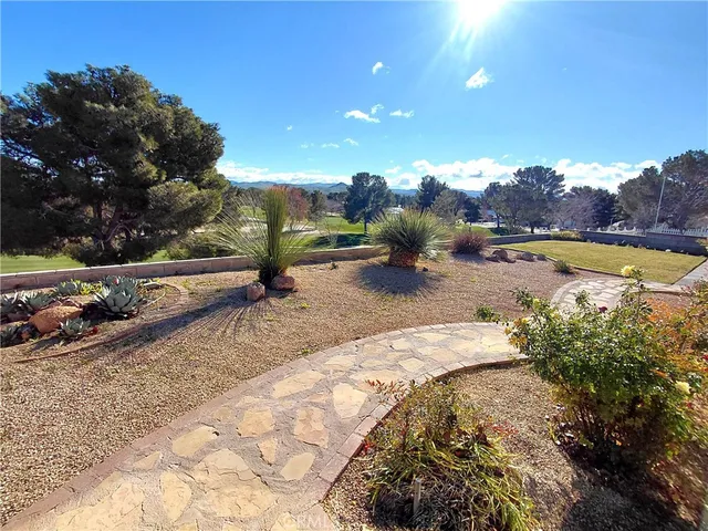 a view of a swimming pool with lounge chair