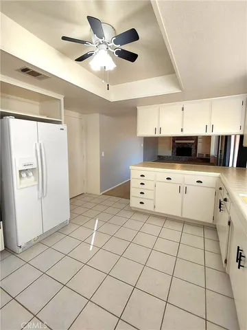 a kitchen with granite countertop cabinets a sink and a stove top oven