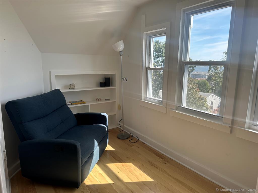 57 Dawson Avenue, Unit 4 West Haven, CT 06516 - Photo 2 of 11 a living room with furniture and a flat screen tv