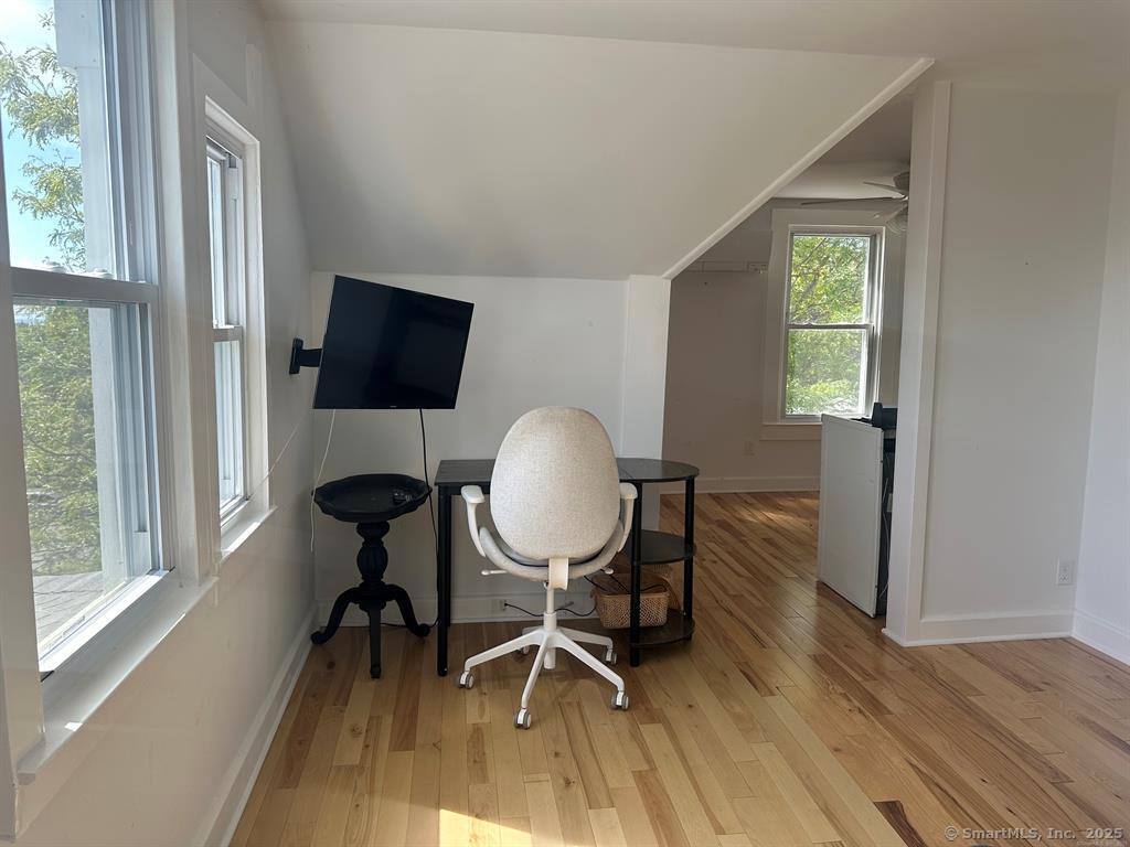 57 Dawson Avenue, Unit 4 West Haven, CT 06516 - Photo 5 of 11 a view of a workspace with furniture and a window
