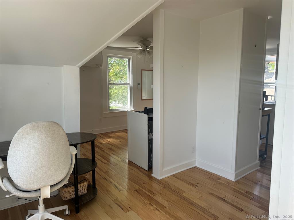 57 Dawson Avenue, Unit 4 West Haven, CT 06516 - Photo 6 of 11 a view of a livingroom with furniture and wooden floor