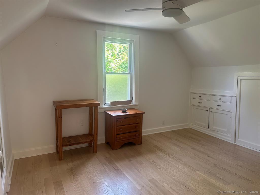 57 Dawson Avenue, Unit 4 West Haven, CT 06516 - Photo 10 of 11 an empty room with a window and dresser