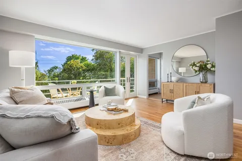 a living room with furniture and a large window
