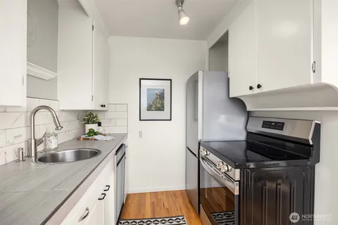 a kitchen with a sink and cabinets