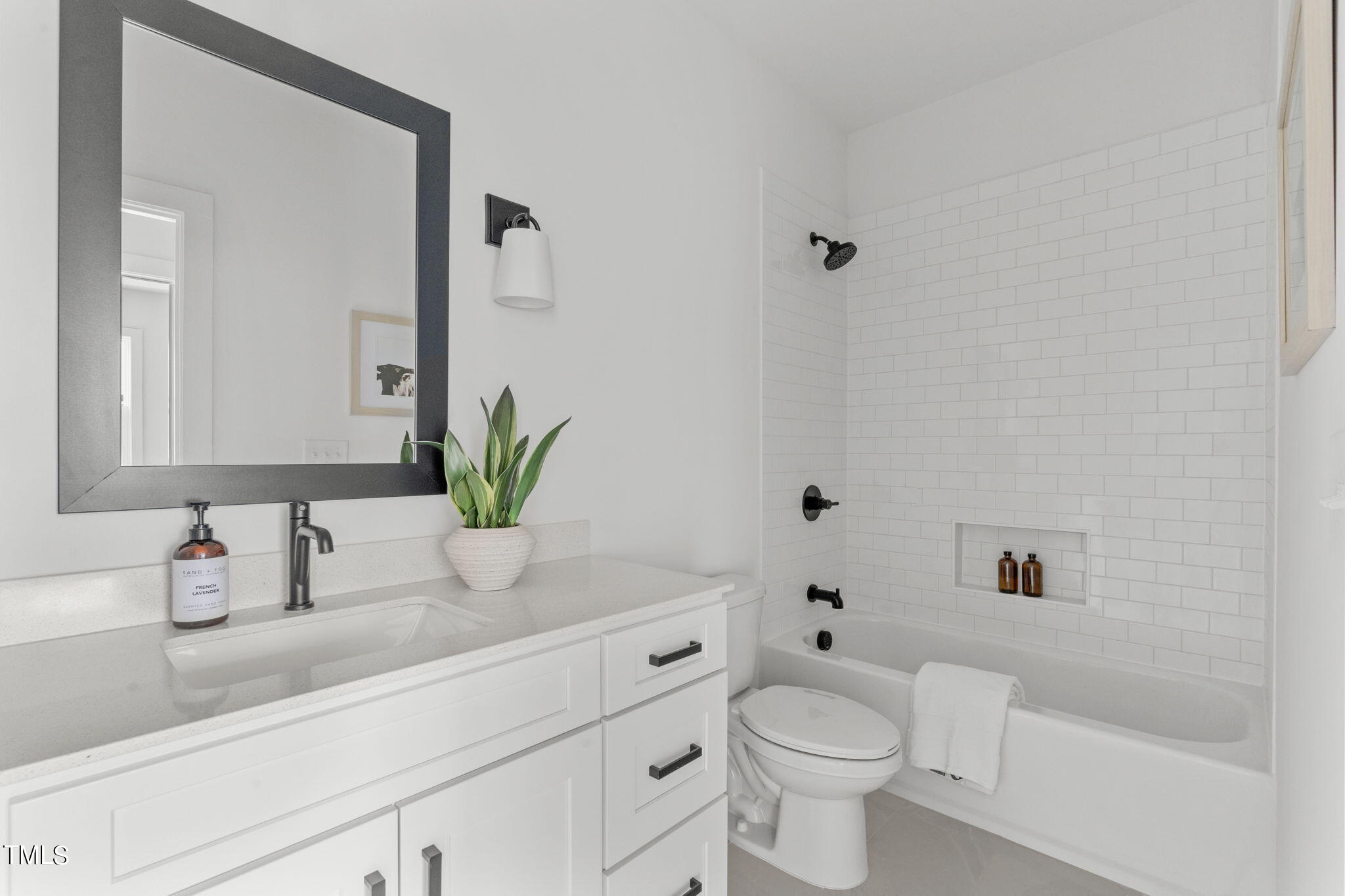 6424 Tanner Oak Lane Raleigh, NC 27613 - Photo 21 of 51 a bathroom with a granite countertop toilet sink and mirror