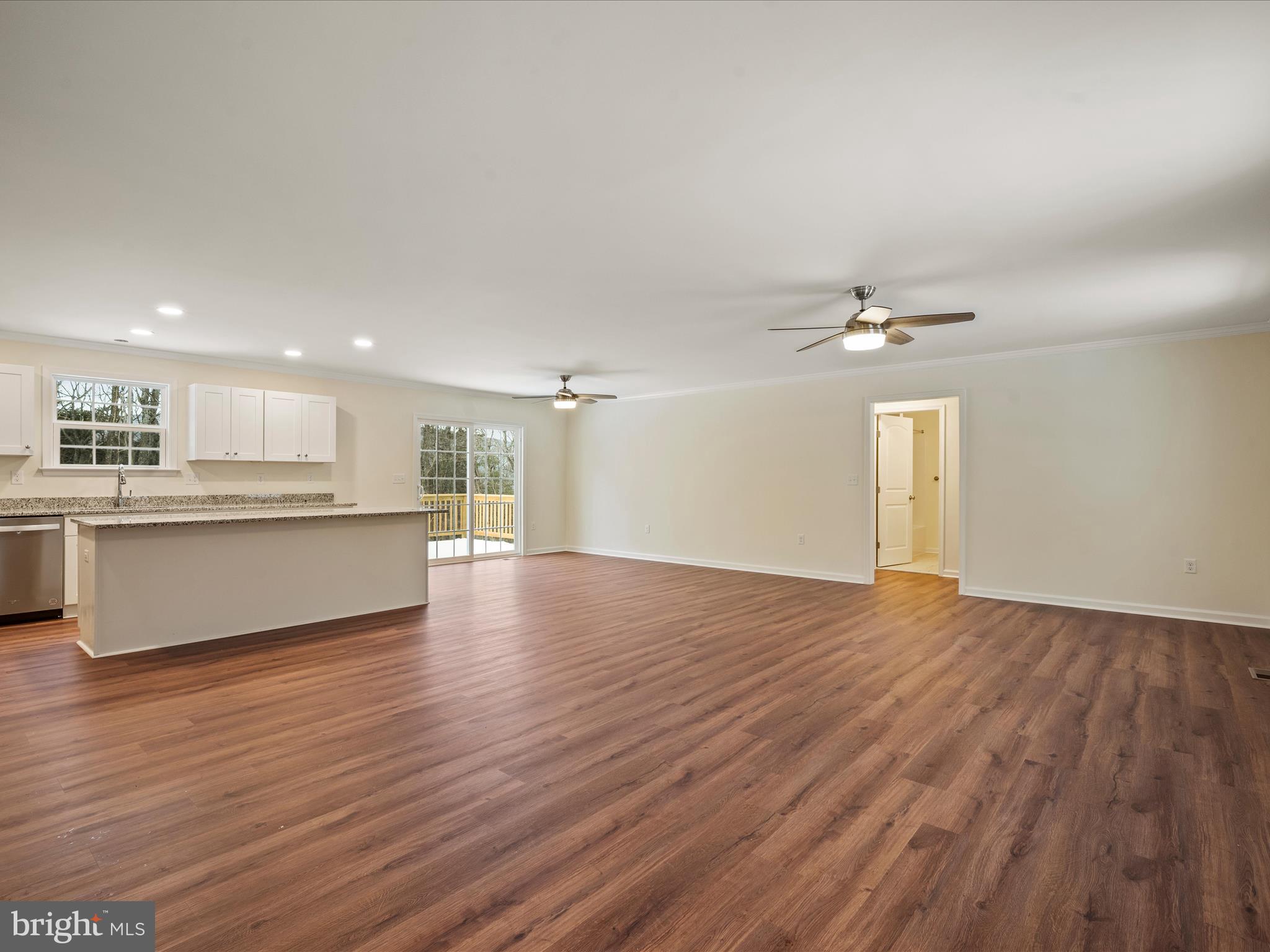 477 North Timber Ridge Road Cross Junction, VA 22625 - Photo 15 of 42 a view of kitchen with wooden floor and windows