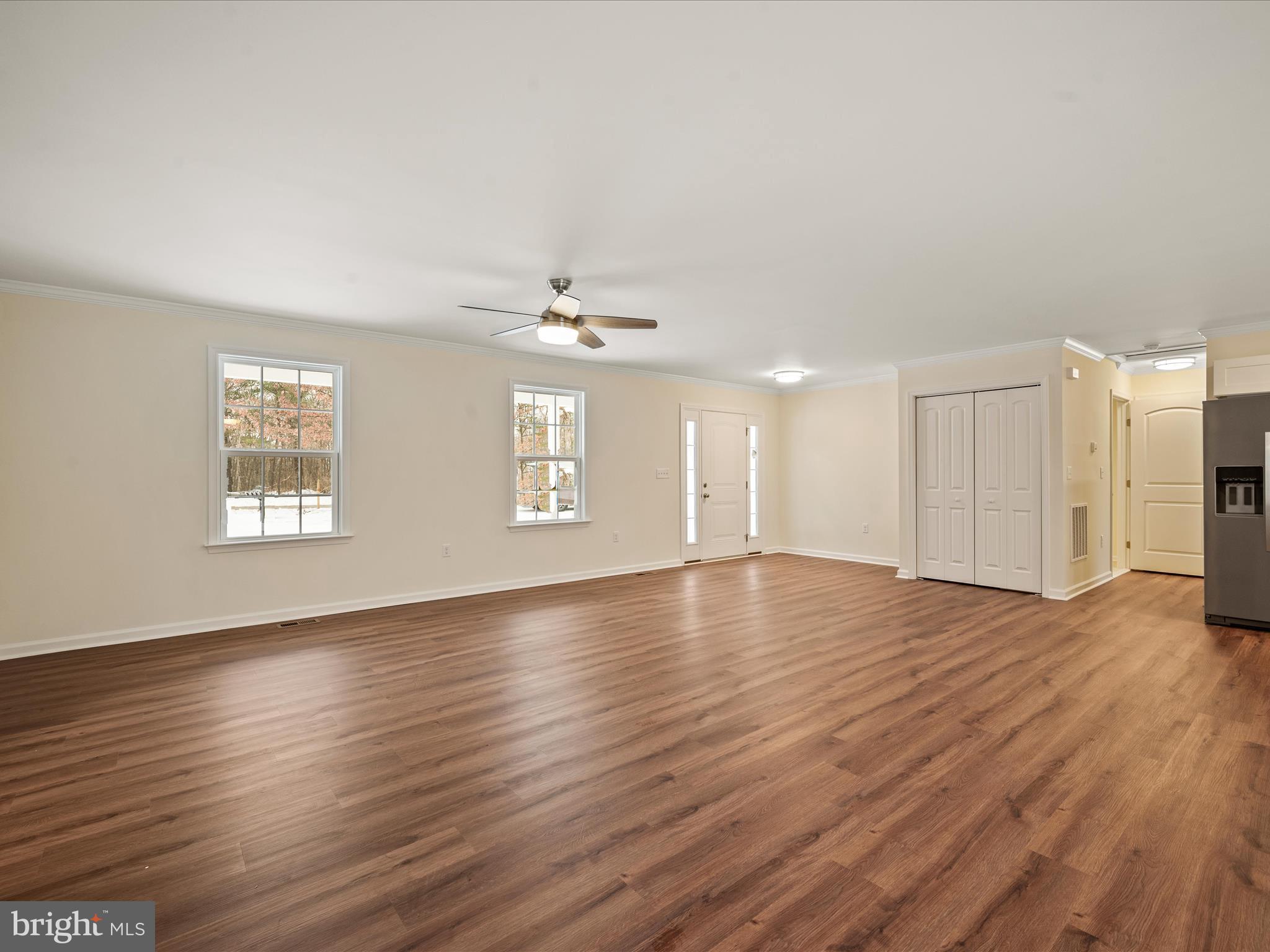 477 North Timber Ridge Road Cross Junction, VA 22625 - Photo 16 of 42 a view of an empty room with wooden floor and a window