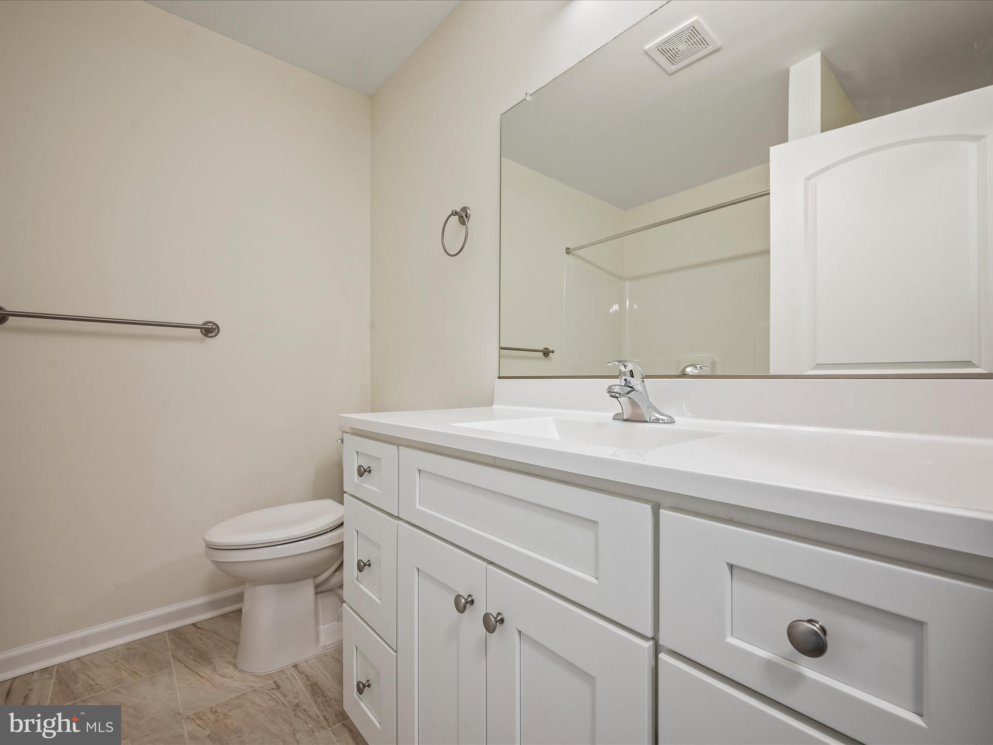 477 North Timber Ridge Road Cross Junction, VA 22625 - Photo 26 of 42 a bathroom with a sink a toilet and a mirror