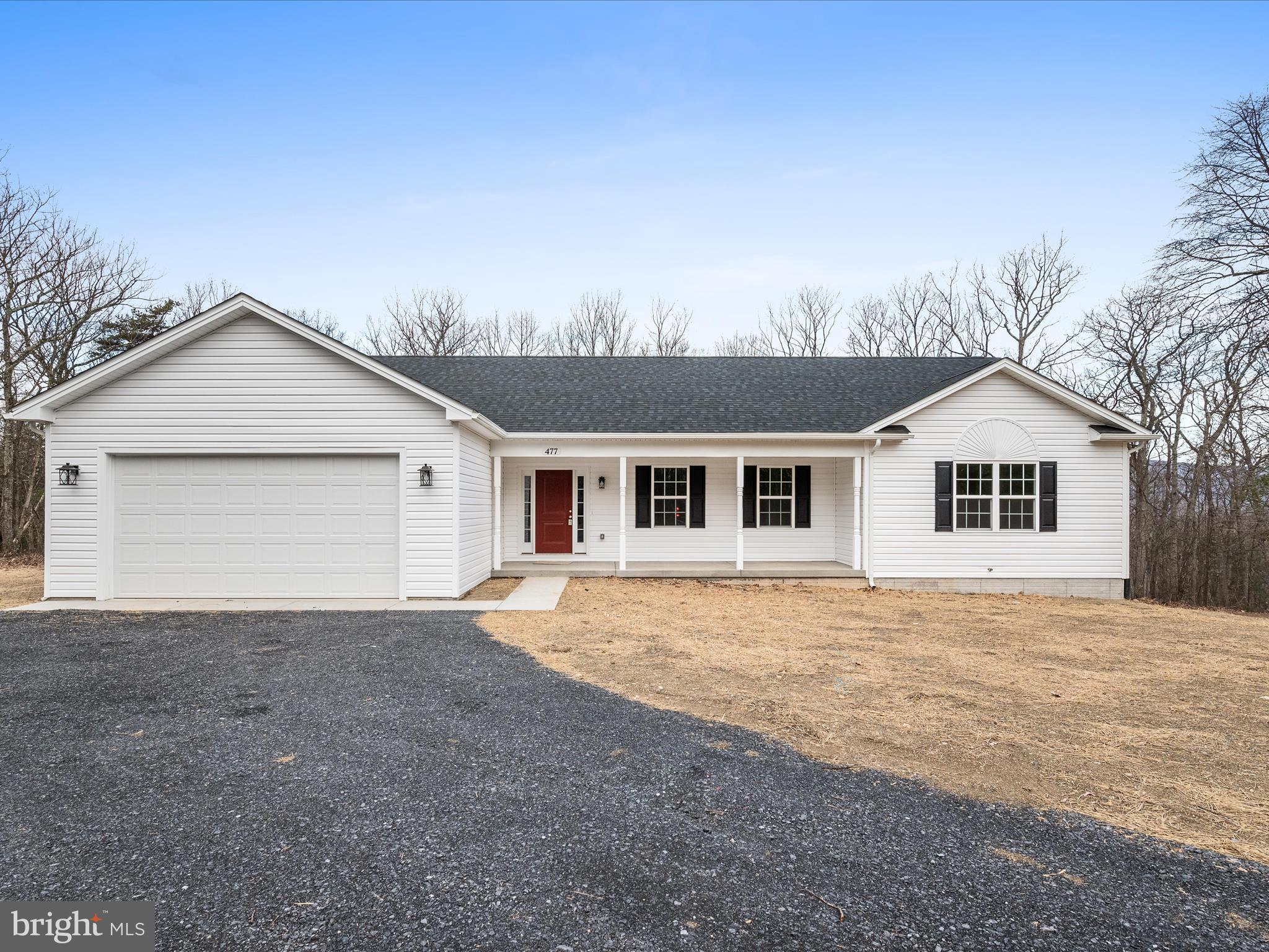 477 North Timber Ridge Road Cross Junction, VA 22625 - Photo 40 of 42 a front view of a house with a yard and garage