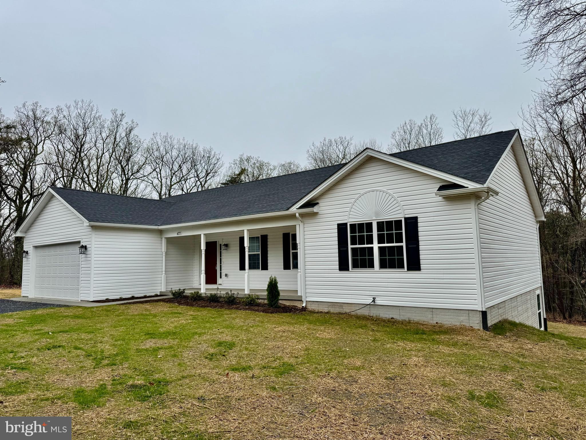 477 North Timber Ridge Road Cross Junction, VA 22625 - Photo 42 of 42 a front view of house with yard and trees in the background