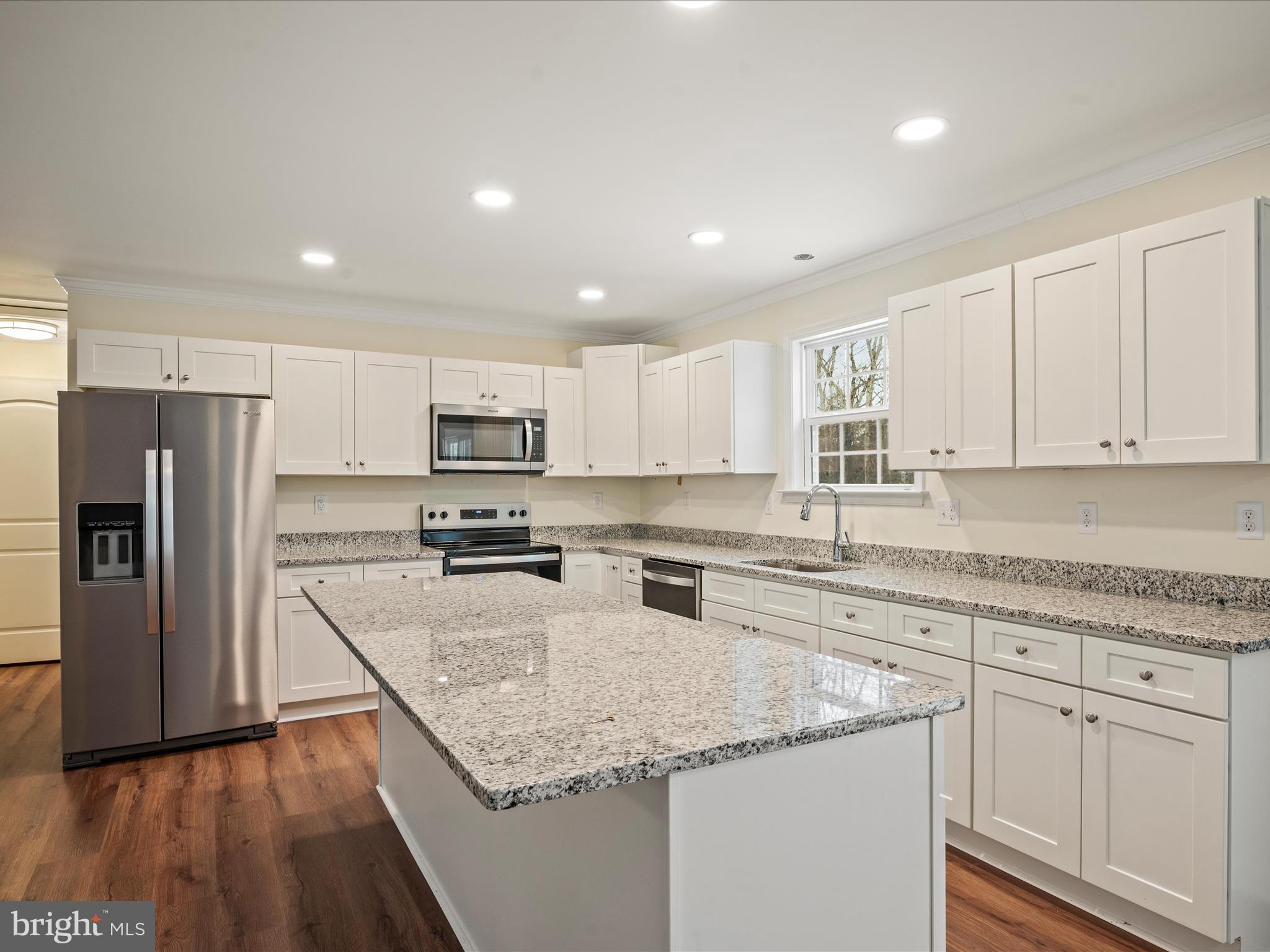 477 North Timber Ridge Road Cross Junction, VA 22625 - Photo 6 of 42 a kitchen with granite countertop stainless steel appliances refrigerator sink and microwave