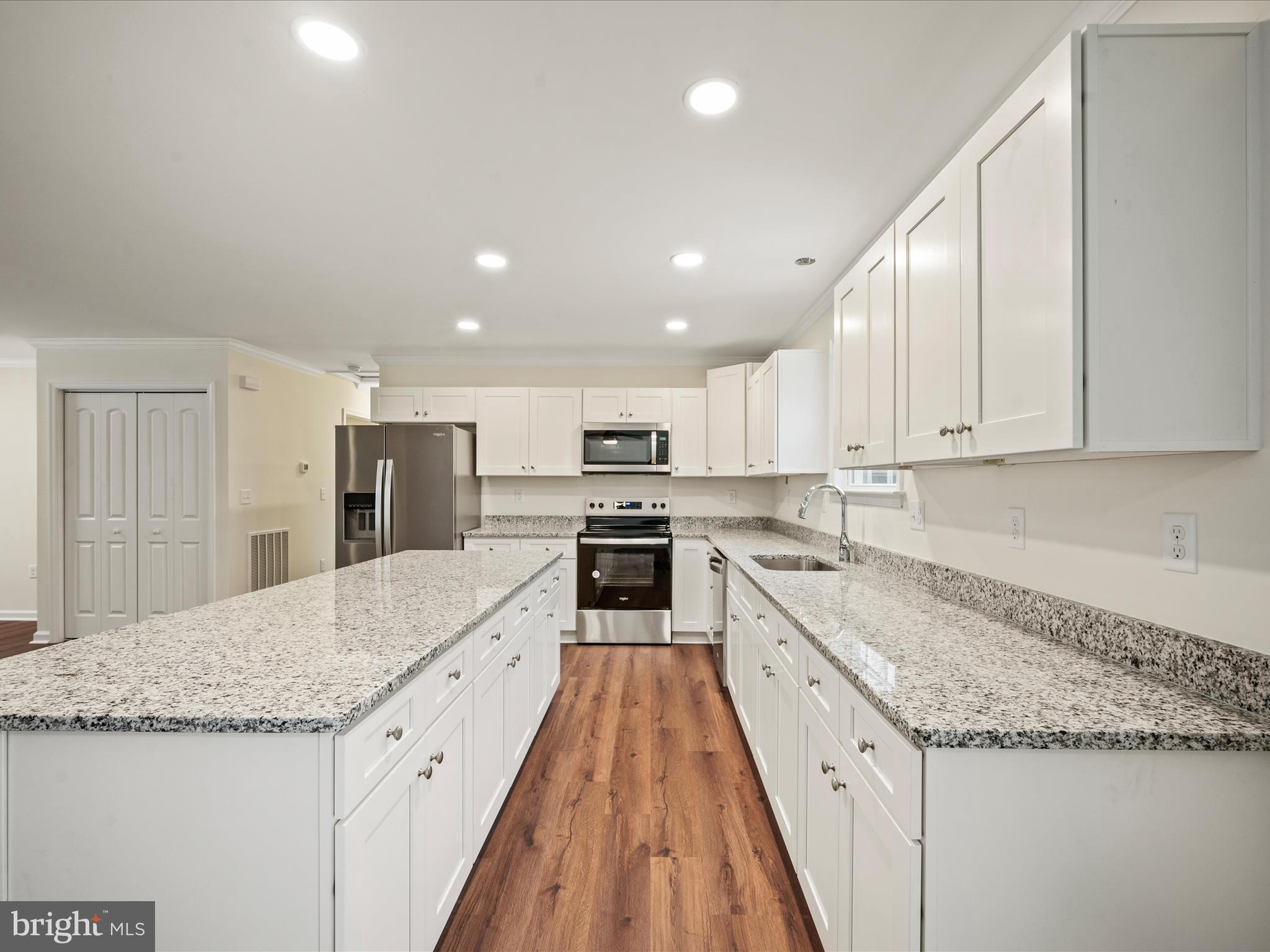 477 North Timber Ridge Road Cross Junction, VA 22625 - Photo 7 of 42 a large kitchen with granite countertop a large counter top and stainless steel appliances