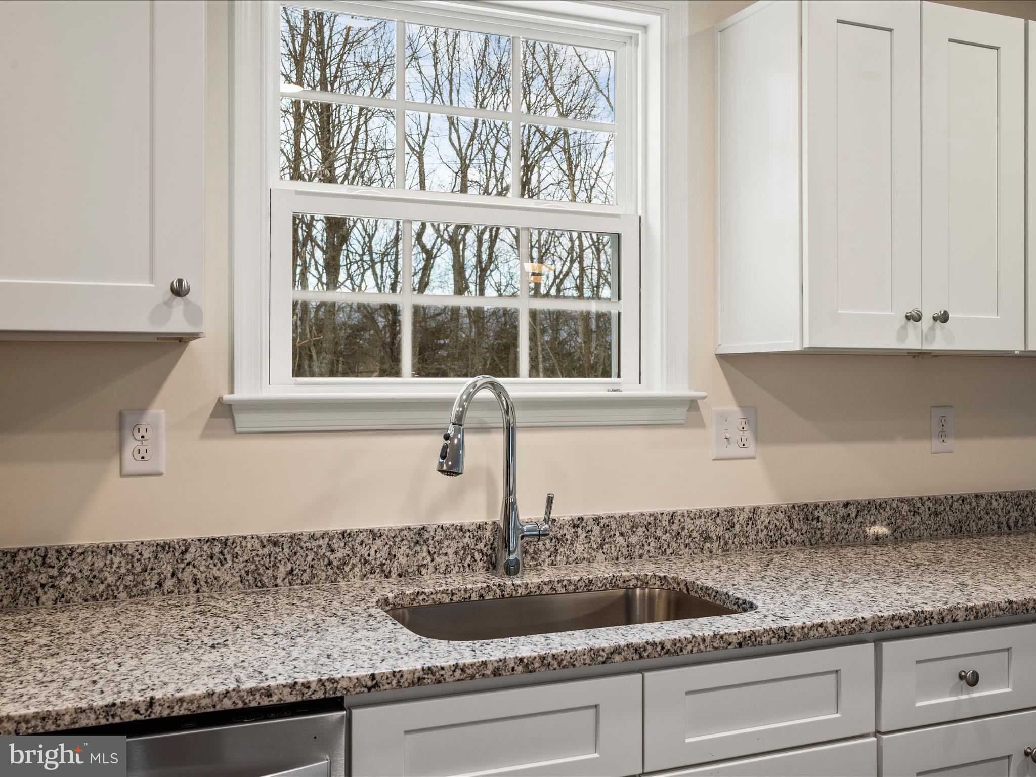 477 North Timber Ridge Road Cross Junction, VA 22625 - Photo 10 of 42 a kitchen with granite countertop a sink and a window