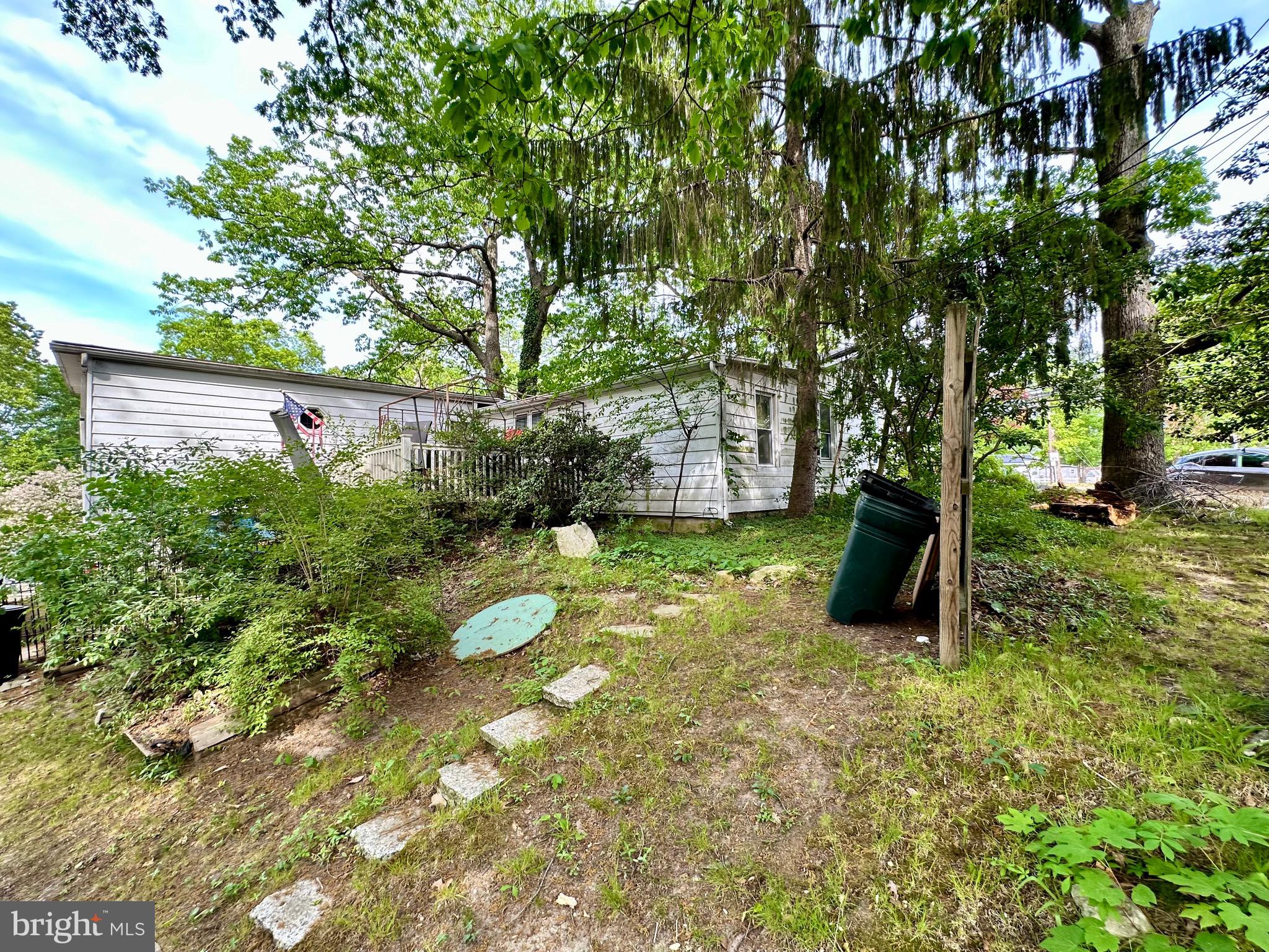 1604 Erial Road Pine Hill, NJ 08021 - Photo 11 of 15 a backyard of a house with plants and large tree