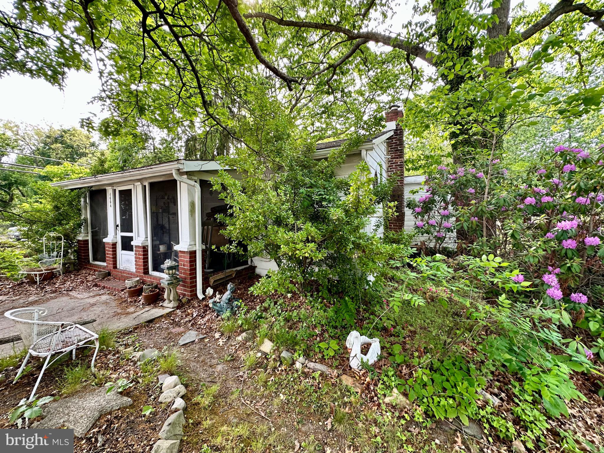 1604 Erial Road Pine Hill, NJ 08021 - Photo 2 of 15 a view of a house with a small yard and sitting area