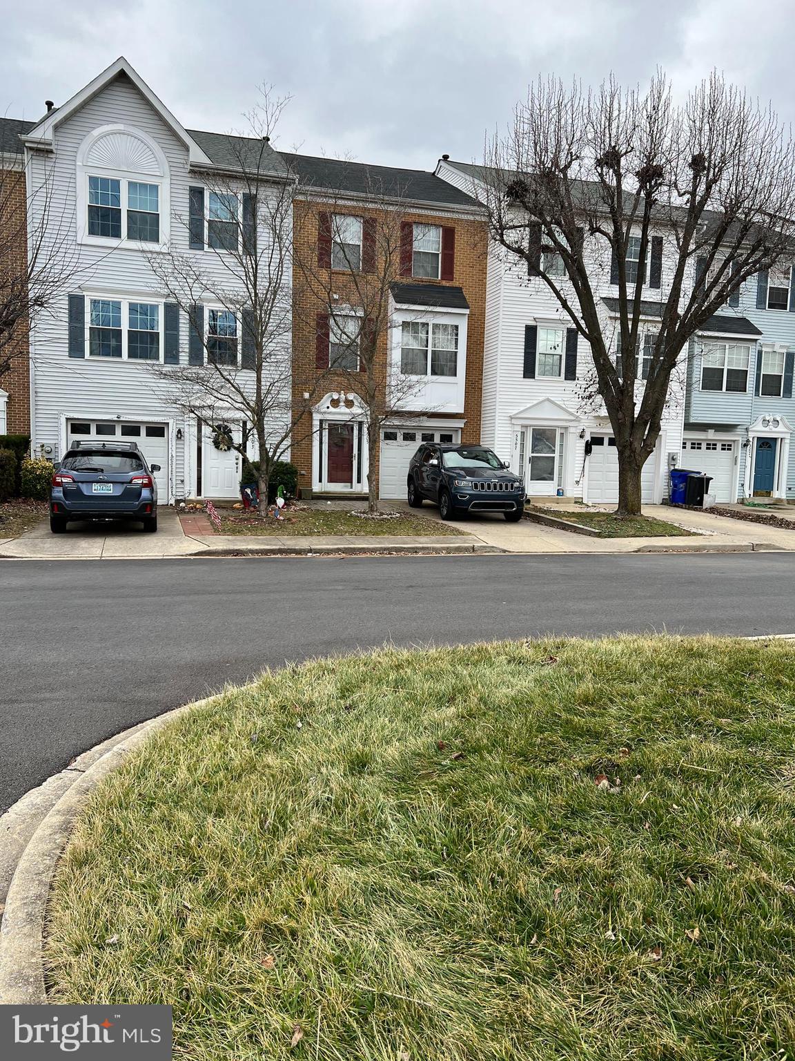 5505 Oberlin Place Frederick, MD 21703 - Photo 2 of 2 a front view of residential houses with yard and trees