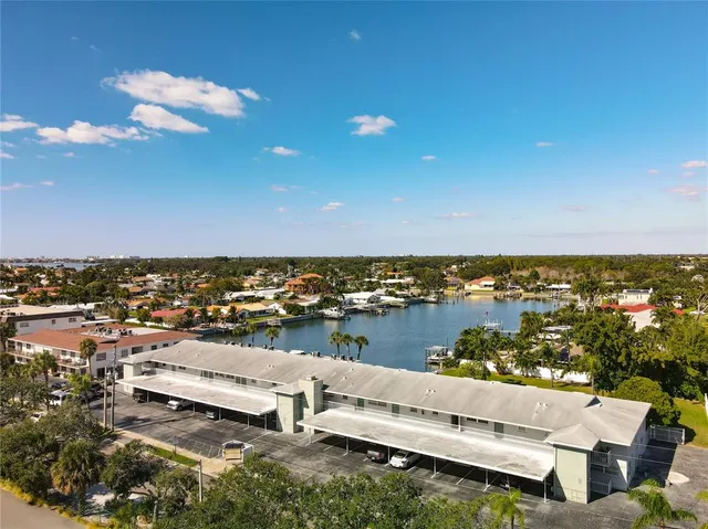an aerial view of a house with a ocean view
