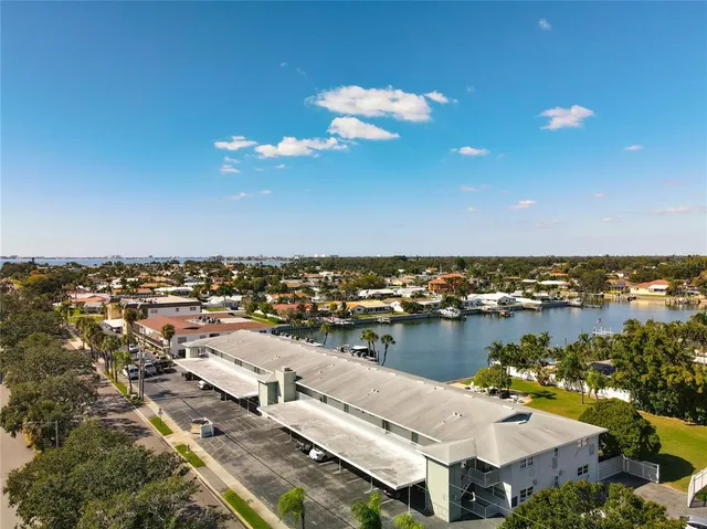 an aerial view of a house with a lake view