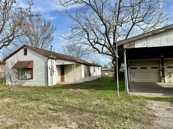a house with trees in the background