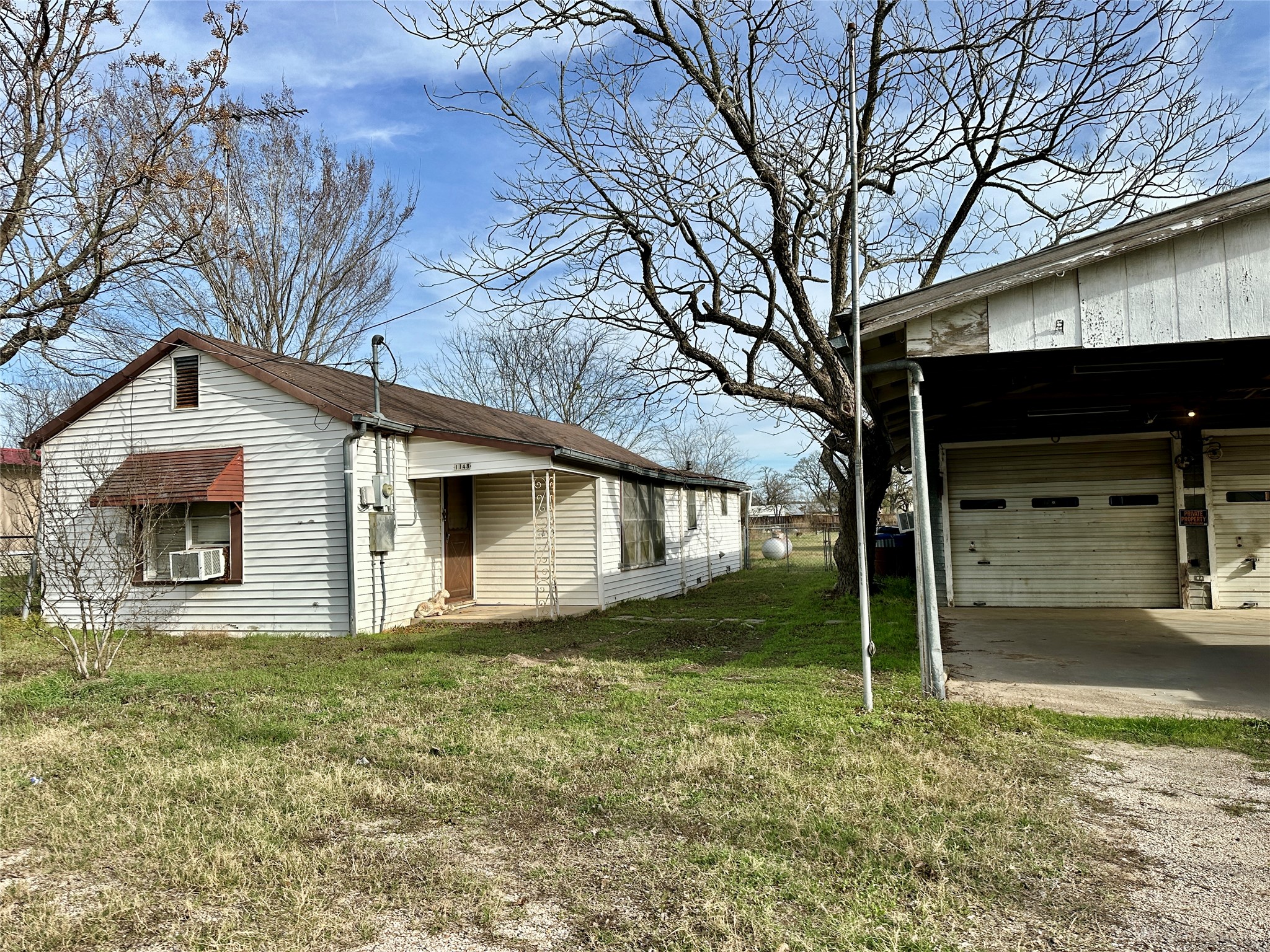 a house with trees in the background