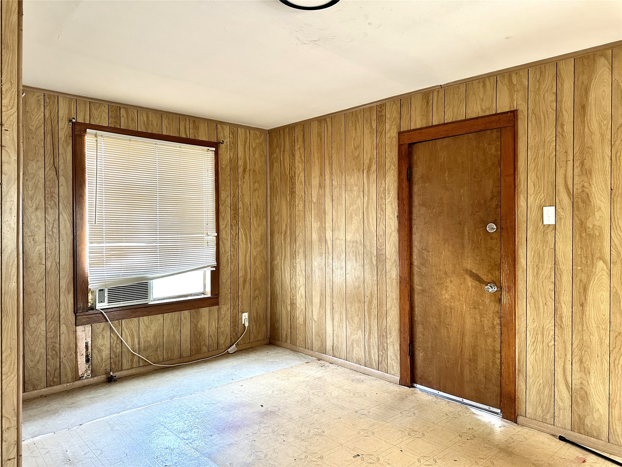 1148 Old Nails Creek Road Giddings, TX 78942 - Photo 14 of 23 an empty room with windows and door