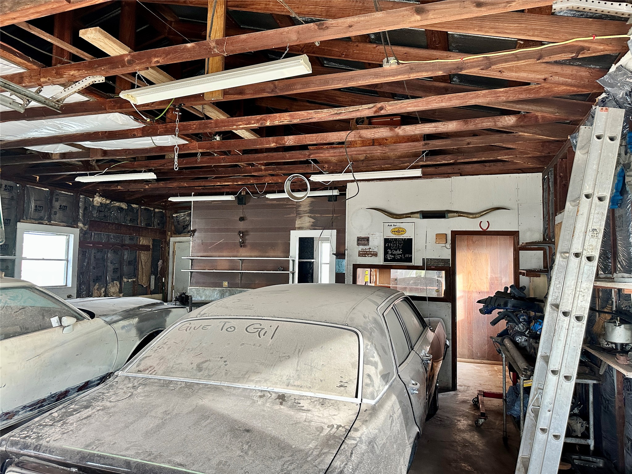 1148 Old Nails Creek Road Giddings, TX 78942 - Photo 20 of 23 a bed room with a bed and a chair