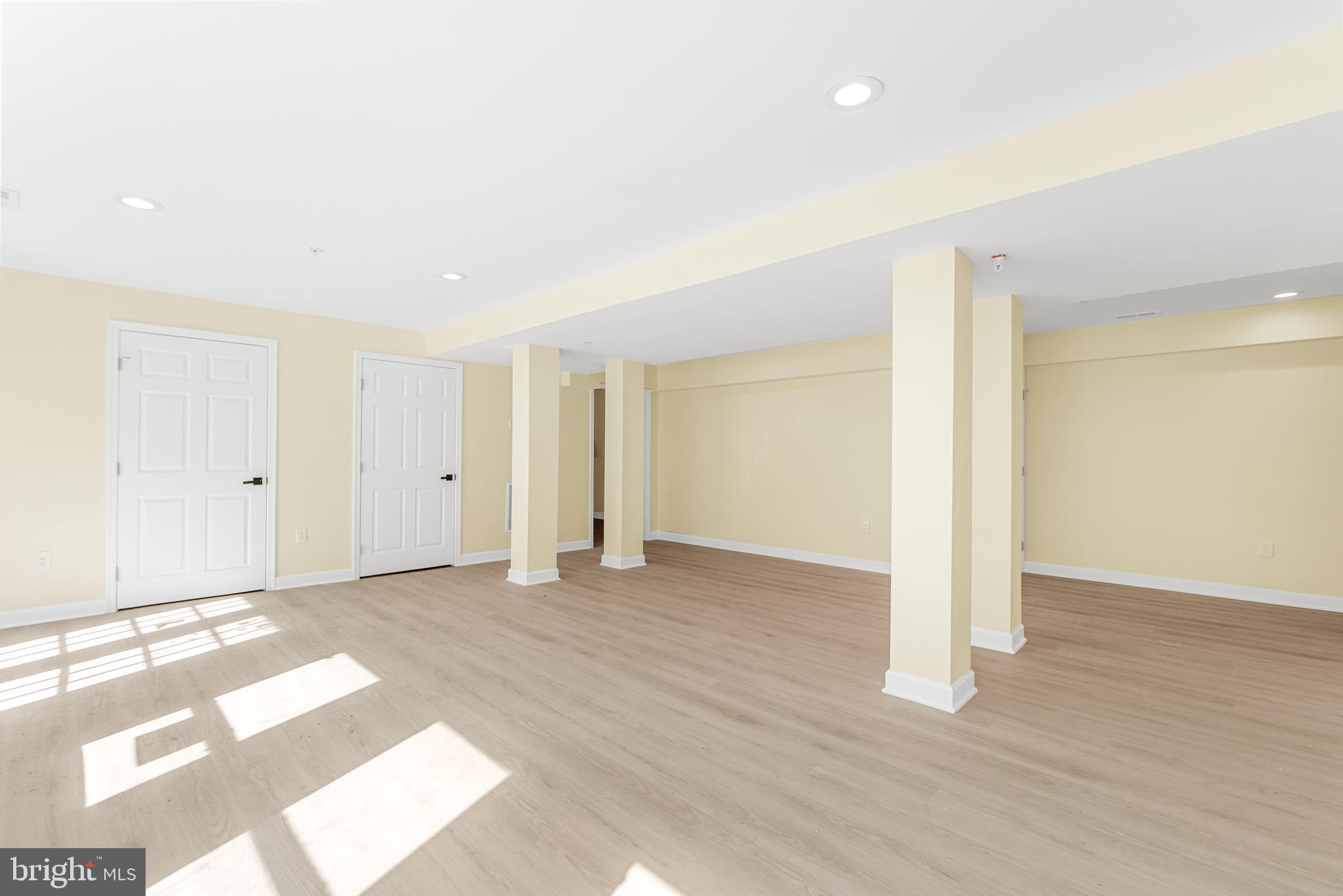 1349 Yorktown Road Annapolis, MD 21409 - Photo 13 of 35 a view of an empty room with wooden floor