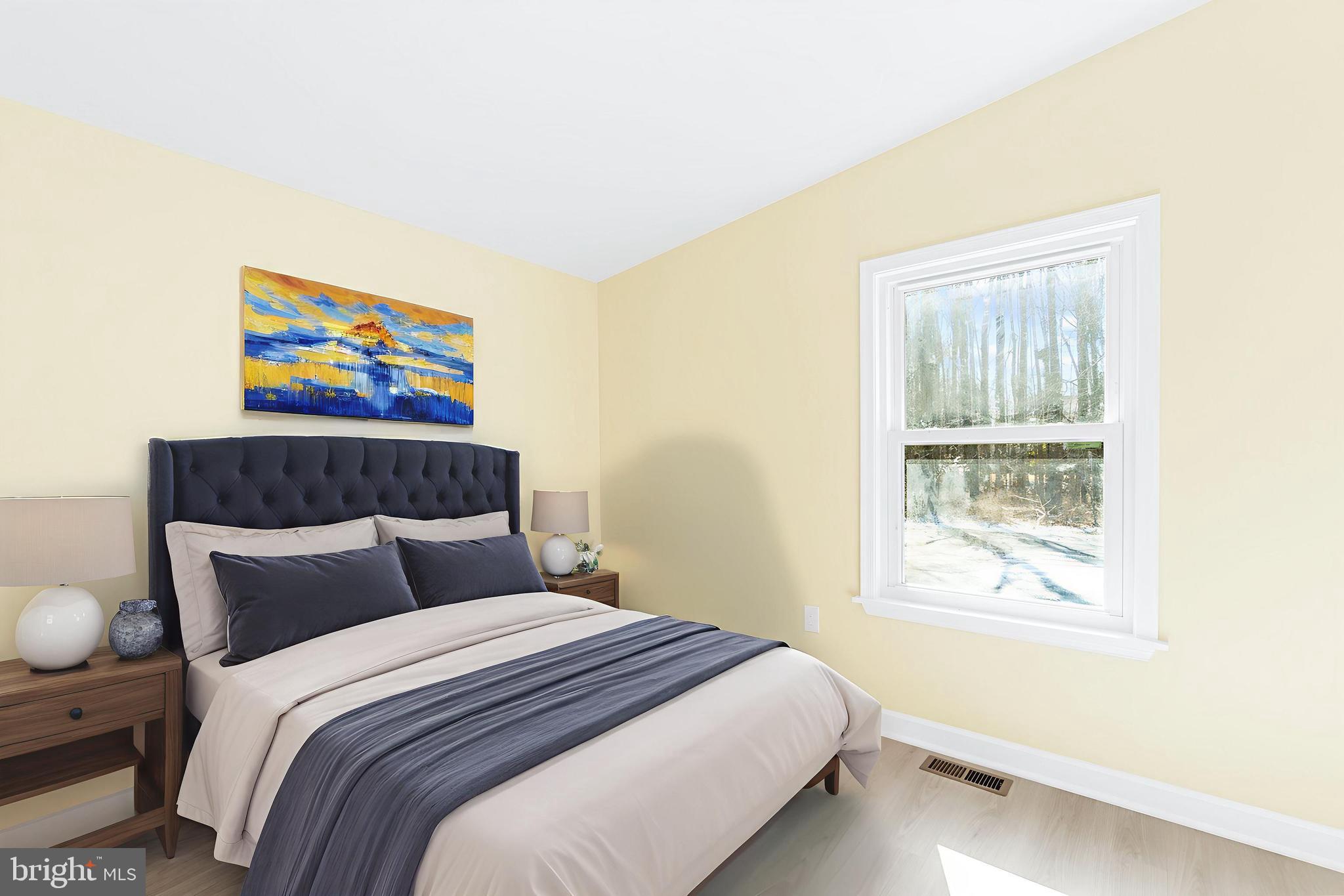 1349 Yorktown Road Annapolis, MD 21409 - Photo 18 of 35 a bedroom with a bed and a painting on the wall