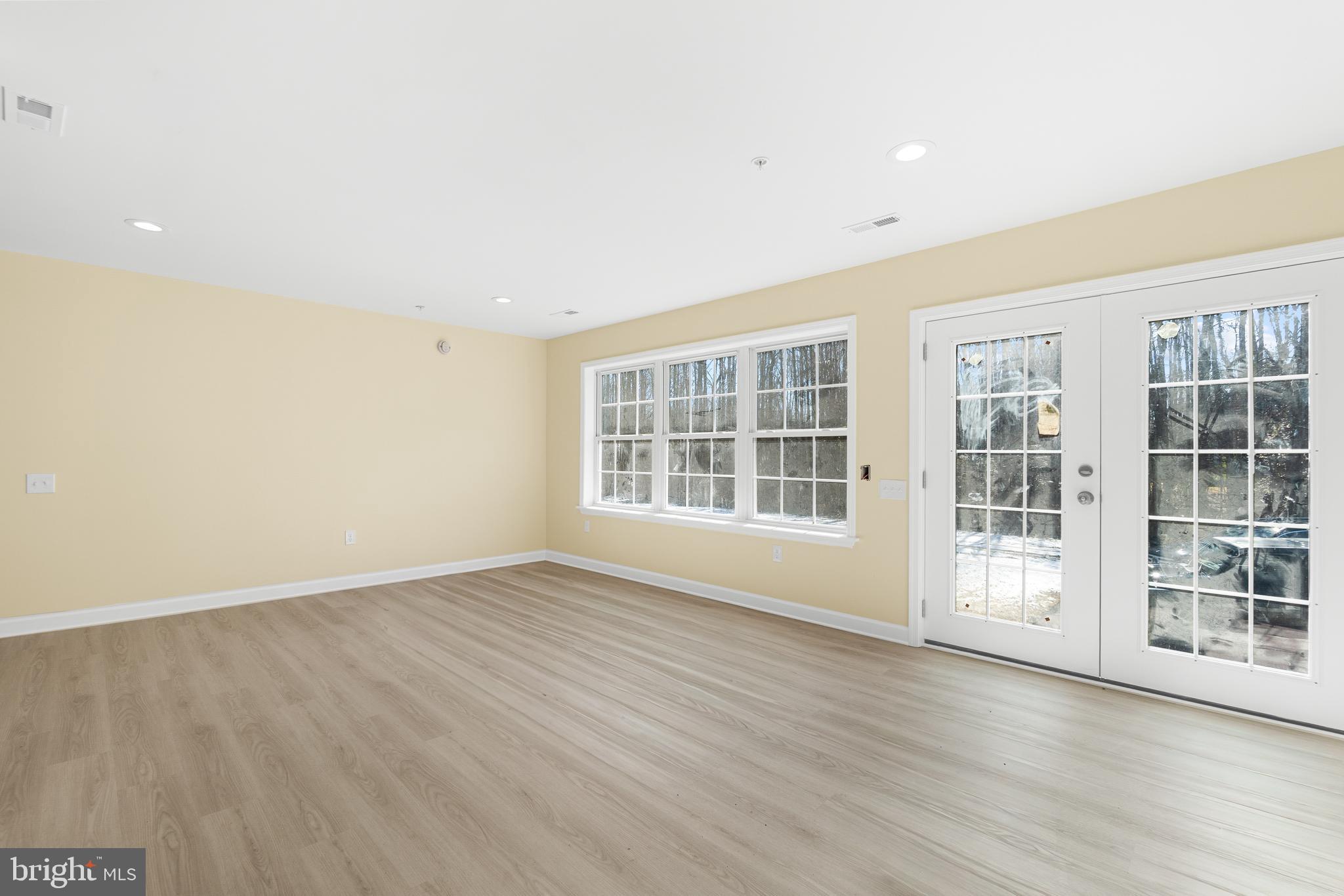 1349 Yorktown Road Annapolis, MD 21409 - Photo 26 of 35 wooden floor in an empty room with a window