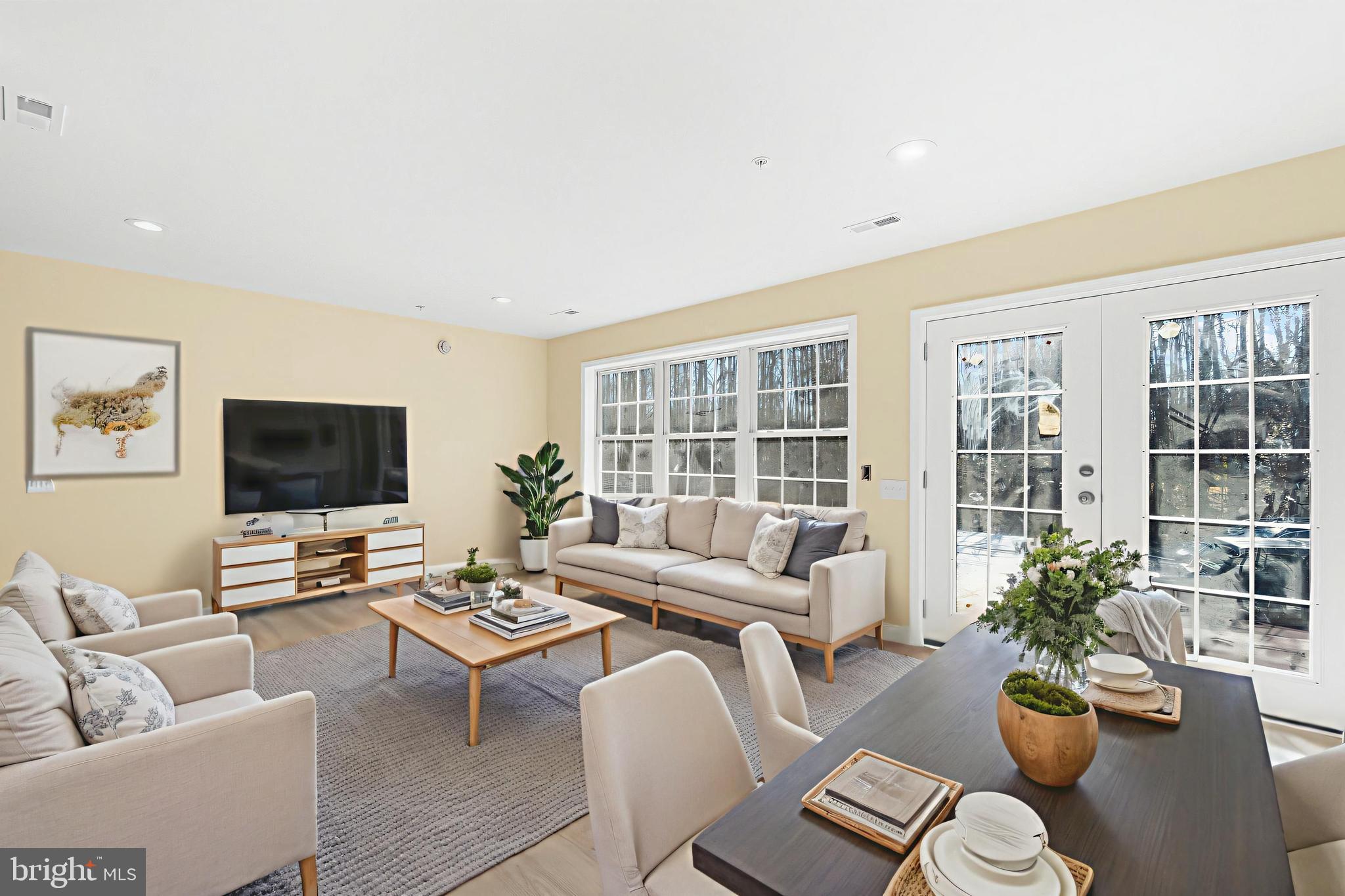 1349 Yorktown Road Annapolis, MD 21409 - Photo 27 of 35 a living room with furniture potted plant and a flat screen tv