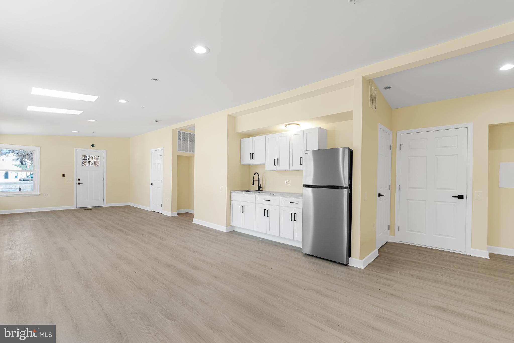 1349 Yorktown Road Annapolis, MD 21409 - Photo 4 of 35 a view of a kitchen with refrigerator and wooden floor