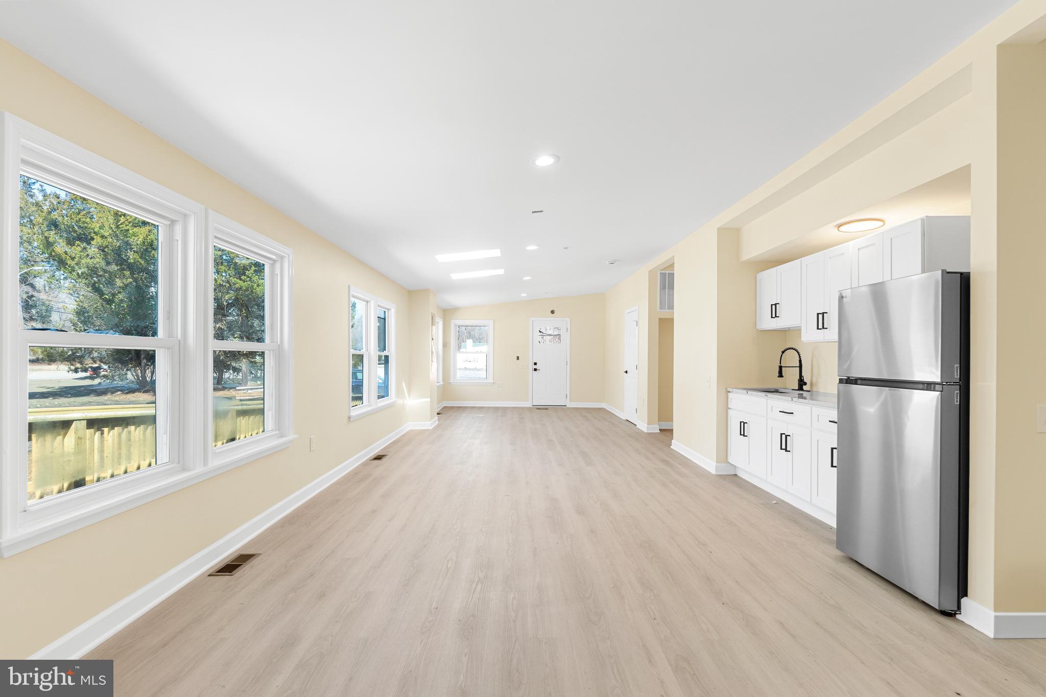 1349 Yorktown Road Annapolis, MD 21409 - Photo 5 of 35 a view of an empty room with window and wooden floor