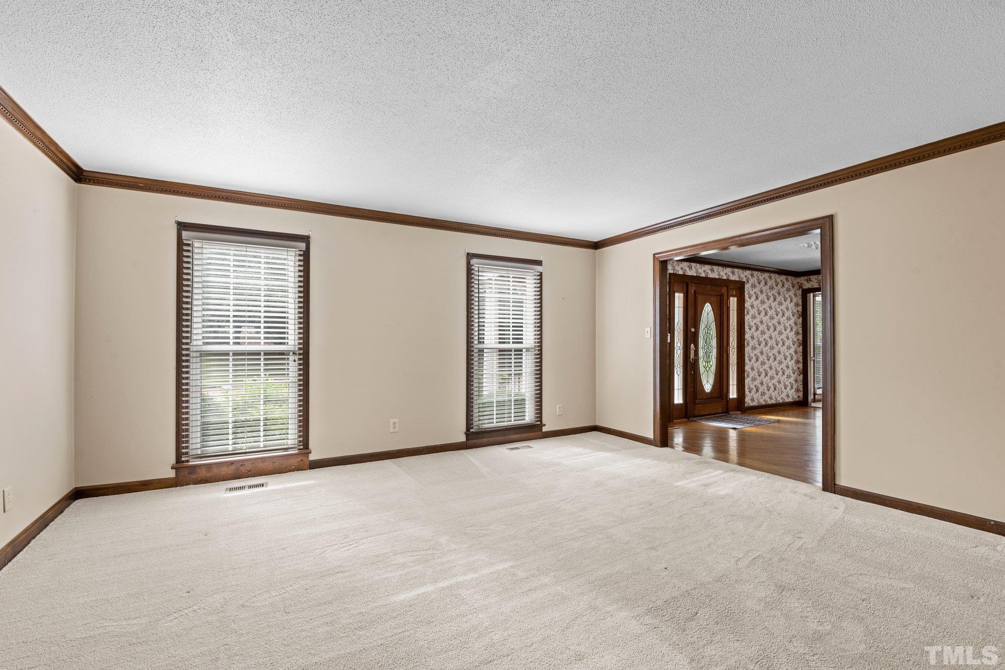 7525 South Tanglewild Drive Raleigh, NC 27613 - Photo 11 of 50 an empty room with windows and closet