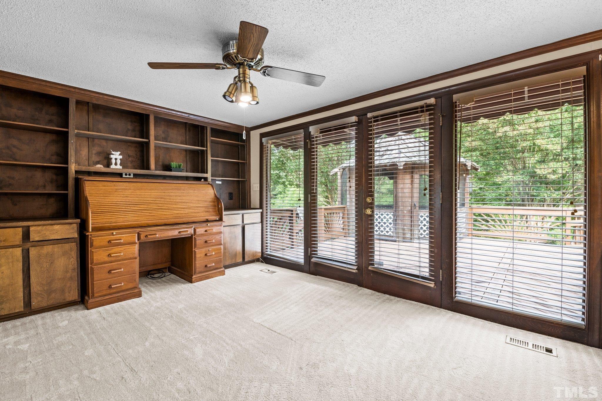 7525 South Tanglewild Drive Raleigh, NC 27613 - Photo 16 of 50 a view of an empty room with a window