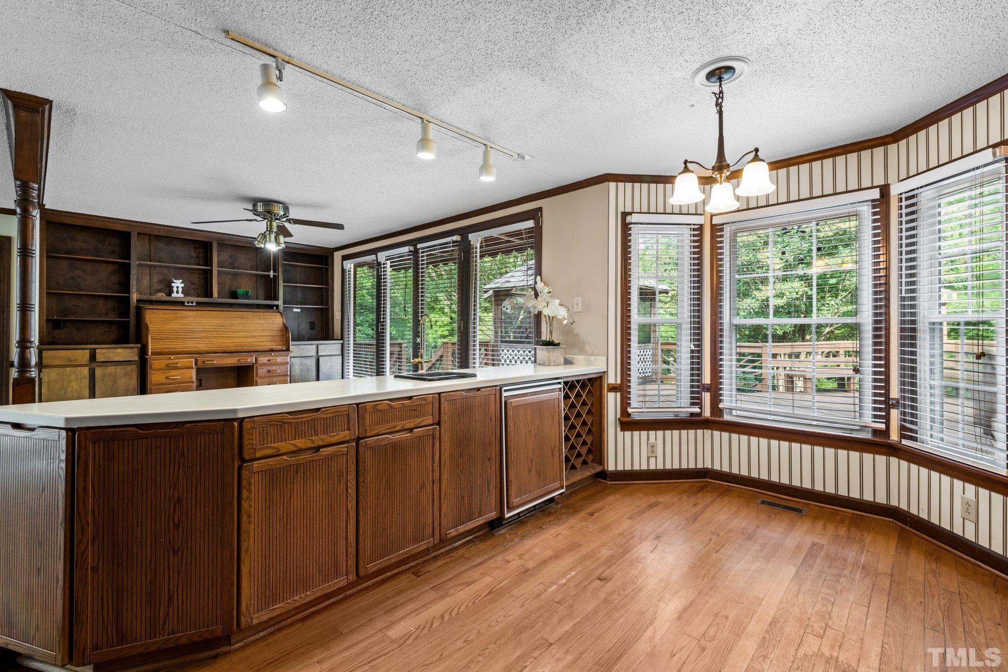 7525 South Tanglewild Drive Raleigh, NC 27613 - Photo 20 of 50 a kitchen with sink and large window