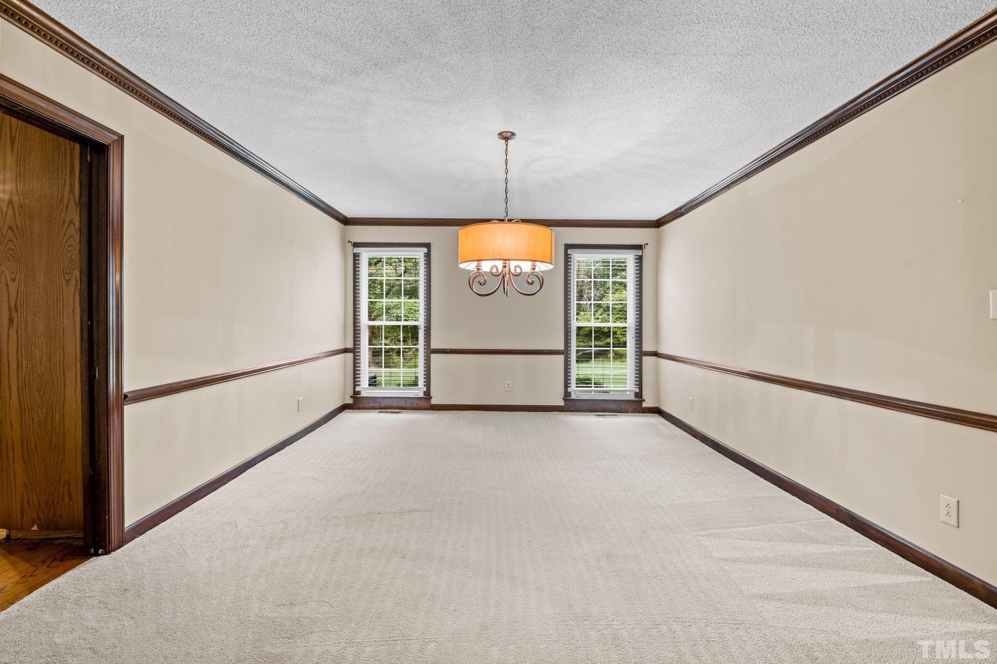 7525 South Tanglewild Drive Raleigh, NC 27613 - Photo 24 of 50 a view of a windows and door in an empty room