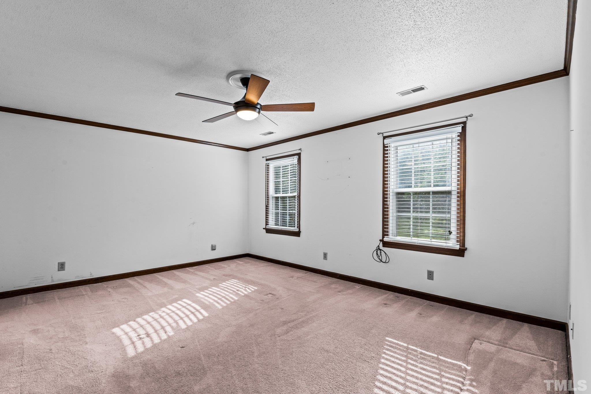 7525 South Tanglewild Drive Raleigh, NC 27613 - Photo 27 of 50 a view of an empty room with a window