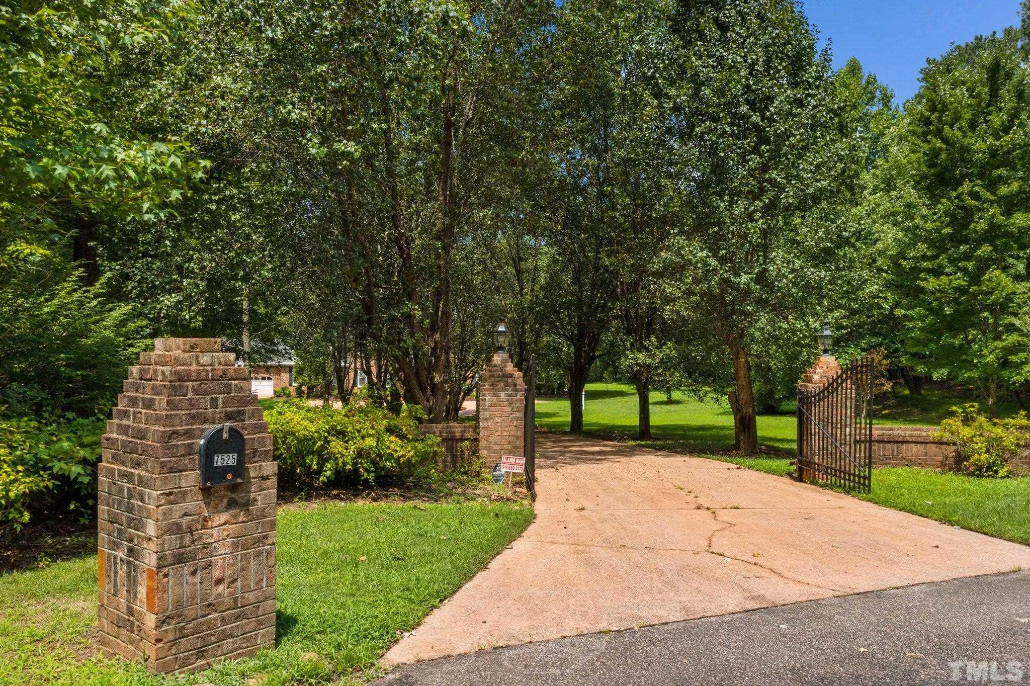 7525 South Tanglewild Drive Raleigh, NC 27613 - Photo 3 of 50 a view of a park with plants and trees