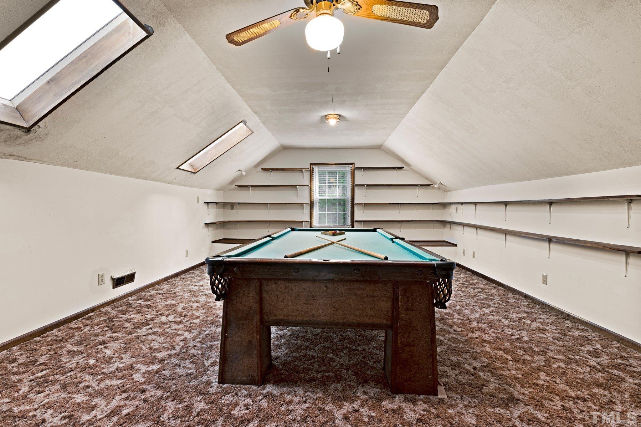 7525 South Tanglewild Drive Raleigh, NC 27613 - Photo 35 of 50 a room with lots of furniture and white walls