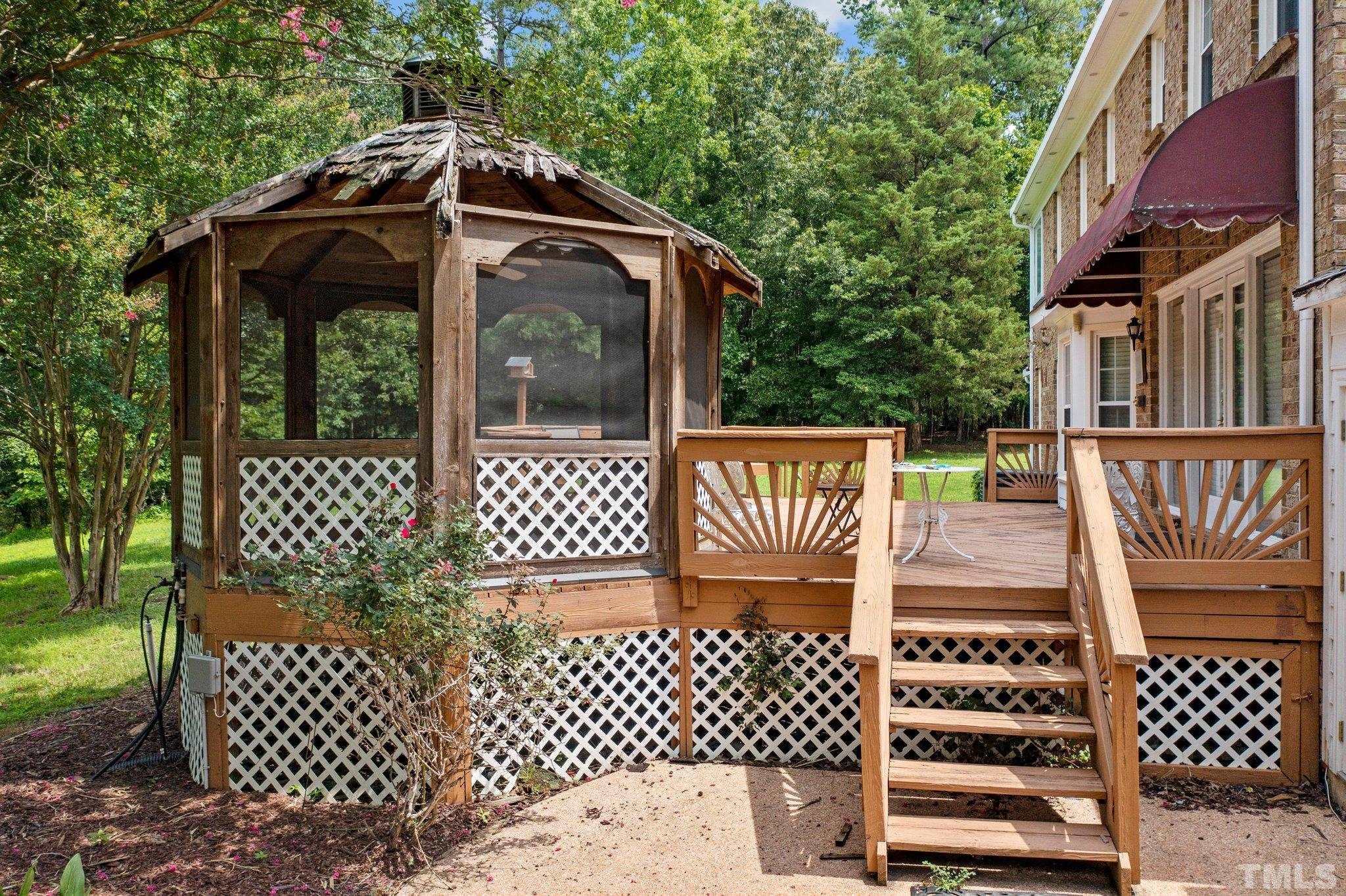 7525 South Tanglewild Drive Raleigh, NC 27613 - Photo 40 of 50 a view of a wooden fence and a yard