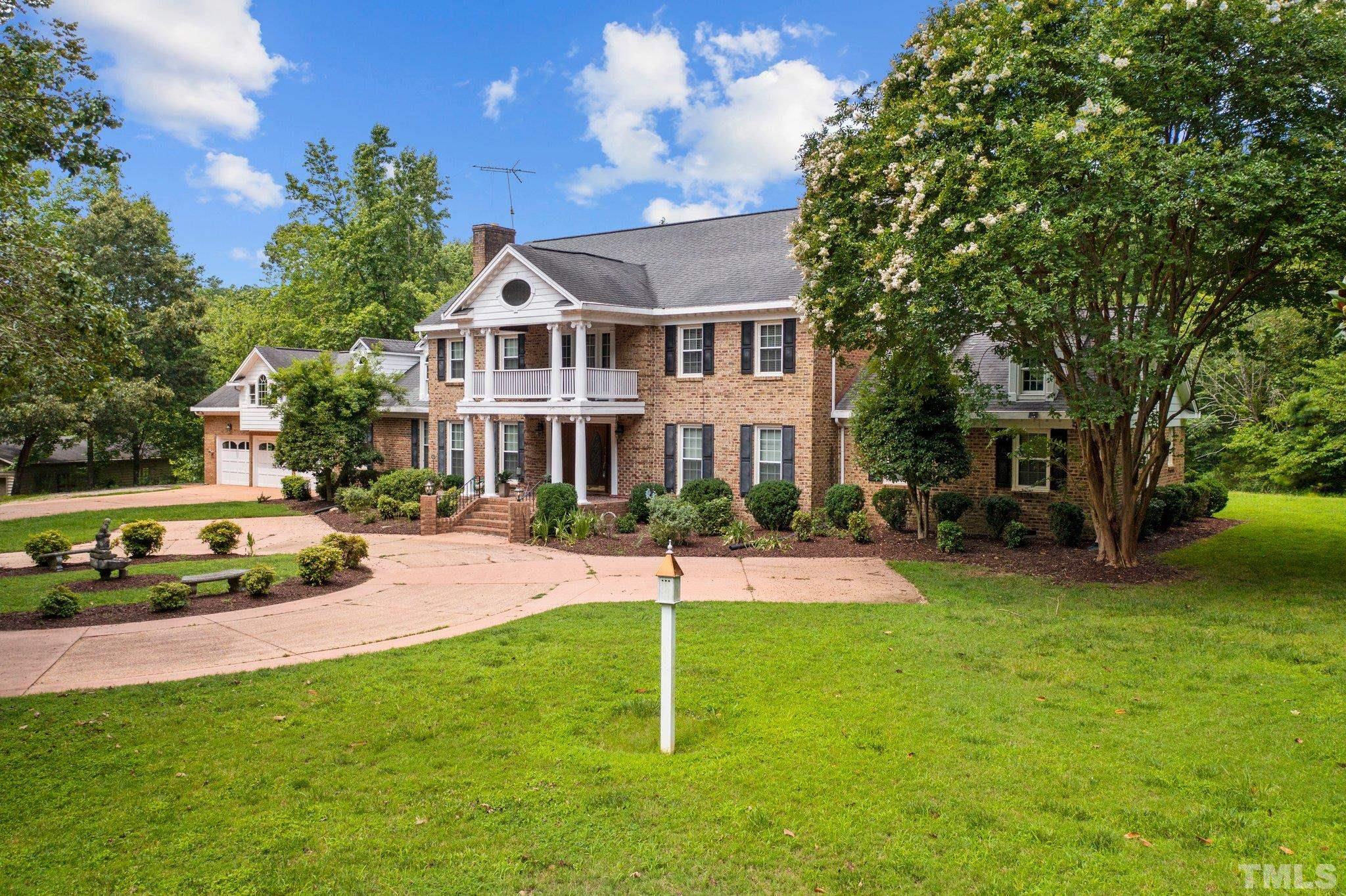 7525 South Tanglewild Drive Raleigh, NC 27613 - Photo 4 of 50 a view of a house with a yard and sitting area