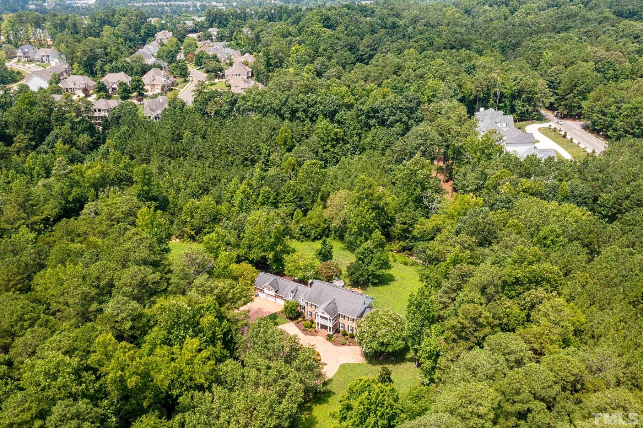 7525 South Tanglewild Drive Raleigh, NC 27613 - Photo 47 of 50 an aerial view of a house with a yard